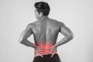 Person experiencing lower back pain